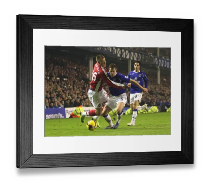 Framed Print : Bendtner vs Jagielka: The Intense Rivalry at Goodison Park, Everton vs Arsenal, Premier League, 2009
