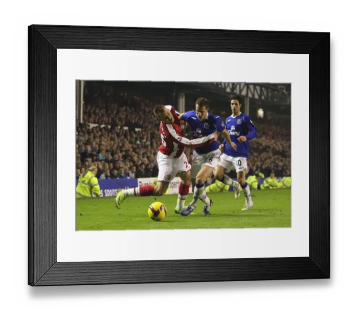 Framed Print : Bendtner vs Jagielka: Stalemate at Goodison Park, Everton vs Arsenal, Barclays Premier League, 2009 Framed Print : Bendtner vs Jagielka: Stalemate at Goodison Park, Everton vs Arsenal, Barclays Premier League, 2009