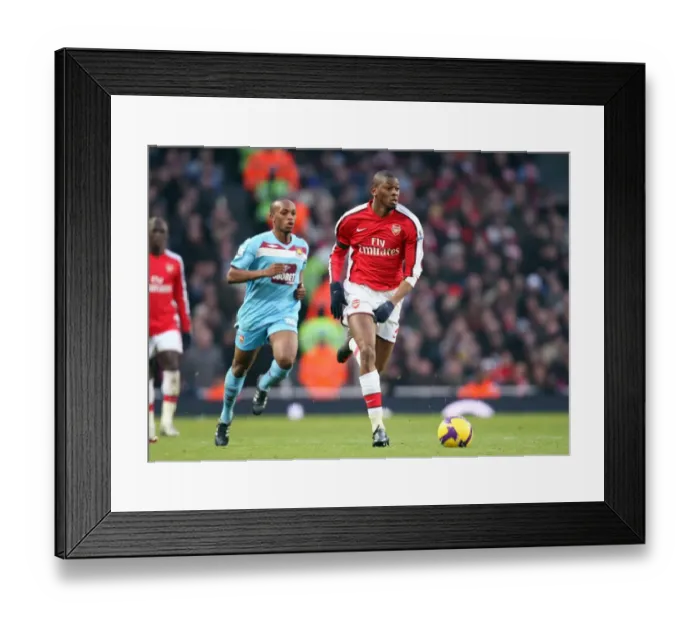 Framed Print : Arsenal vs. West Ham: A Battle of Midfielders - Abou Diaby and Savio Nsereko Face Off in a Scoreless Barclays Premier League Clash at Emirates Stadium (January 2009)