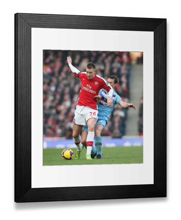 Framed Print : Arsenal's Bendtner and Parker Face Off in Scoreless Draw Against West Ham, Emirates Stadium, 2009 Framed Print : Arsenal's Bendtner and Parker Face Off in Scoreless Draw Against West Ham, Emirates Stadium, 2009
