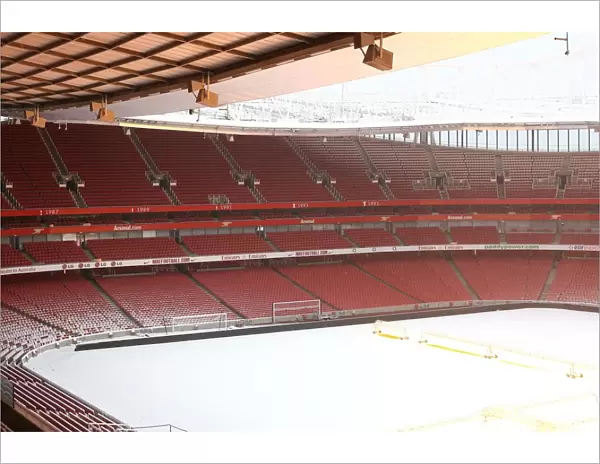Winter's Embrace: Arsenal's Emirates Stadium in Snow