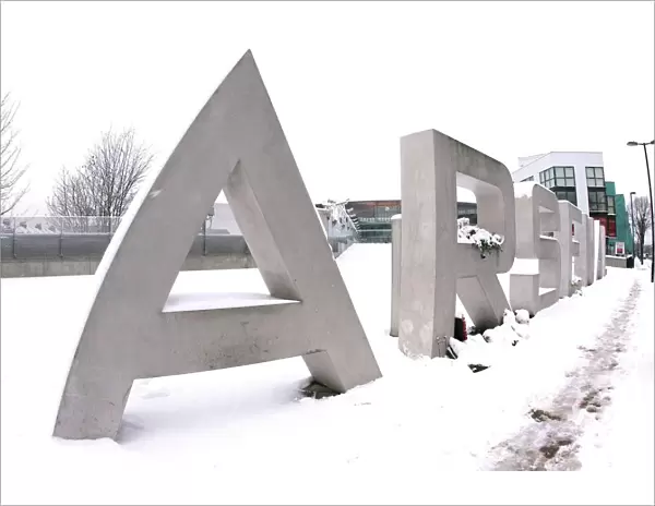 Winter's Embrace: Arsenal's Snow-Covered Emirates Stadium