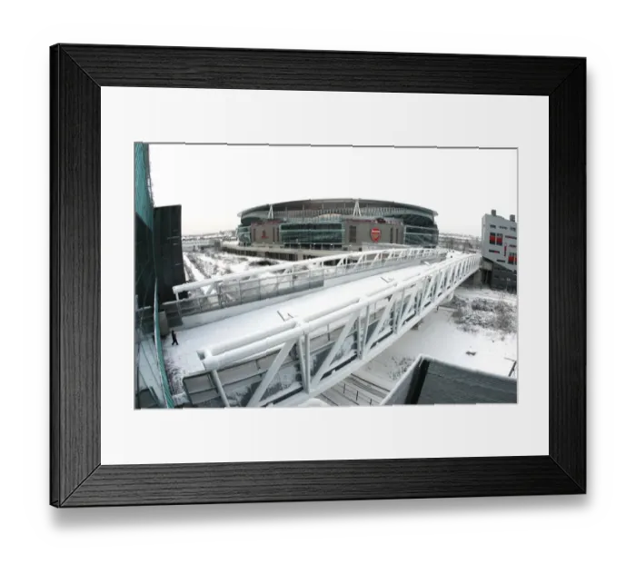 Framed Print : Winter's Embrace at Emirates: A Snowy Transformation of Arsenal Football Club's Stadium