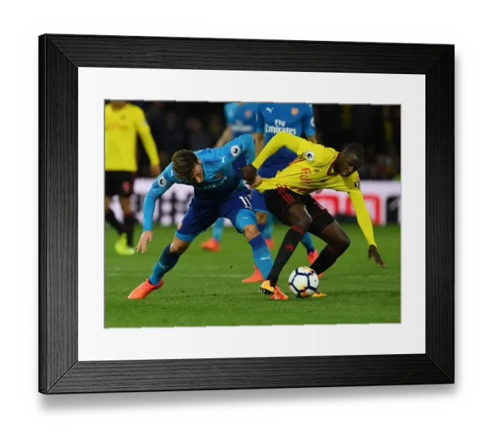 Framed Print : Clash at Vicarage Road: Ozil vs. Doucoure Framed Print : Clash at Vicarage Road: Ozil vs. Doucoure