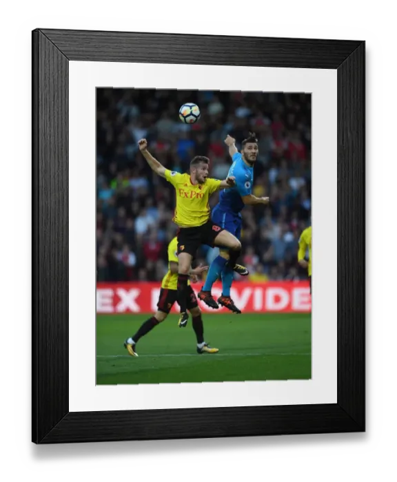 Framed Print : Clash at Vicarage Road: Kolasinac vs. Cleverley in the Premier League Showdown Framed Print : Clash at Vicarage Road: Kolasinac vs. Cleverley in the Premier League Showdown