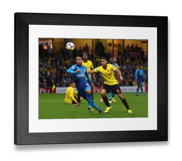 Framed Print : Lacazette vs Mariappa: Intense Battle at Vicarage Road - Watford vs Arsenal, Premier League 2017-18
