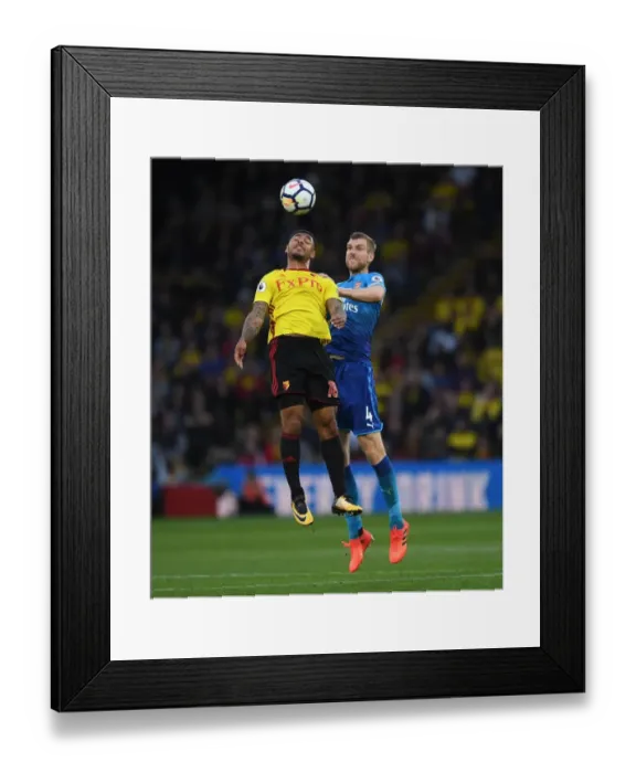 Framed Print : Per Mertesacker vs. Andre Gray: Heading Clash in Arsenal's Victory over Watford (2017-18) Framed Print : Per Mertesacker vs. Andre Gray: Heading Clash in Arsenal's Victory over Watford (2017-18)