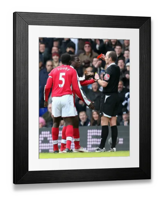 Framed Print : Emmanuel Eboue (Arsenal) is shown the Red Card by referee Mike Dean