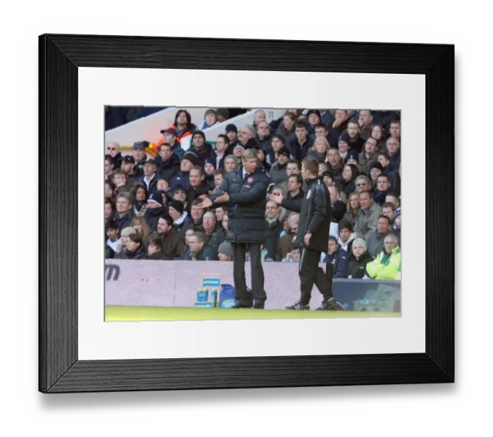 Framed Print : Arsene Wenger the Arsenal Manager talks with the 4th official Framed Print : Arsene Wenger the Arsenal Manager talks with the 4th official