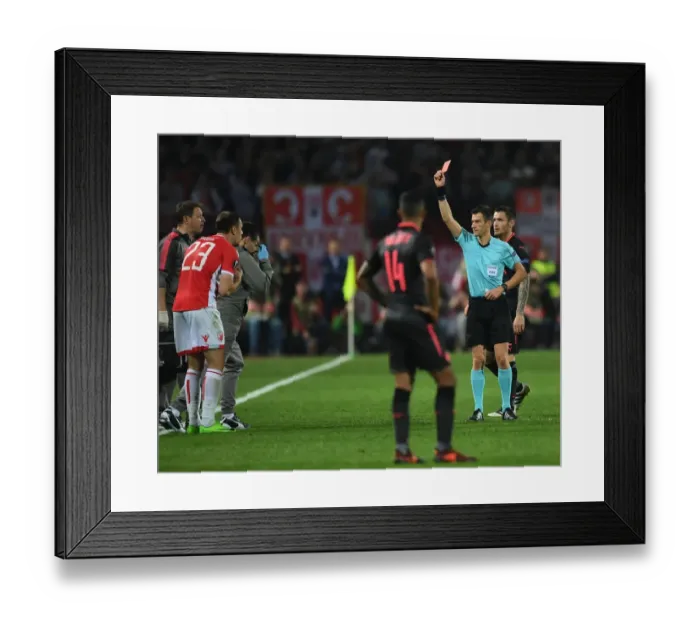 Framed Print : Arsenal's Europa League Clash with Crvena Zvezda: Hicham Zakrani Shows Red Card to Milan Rodic
