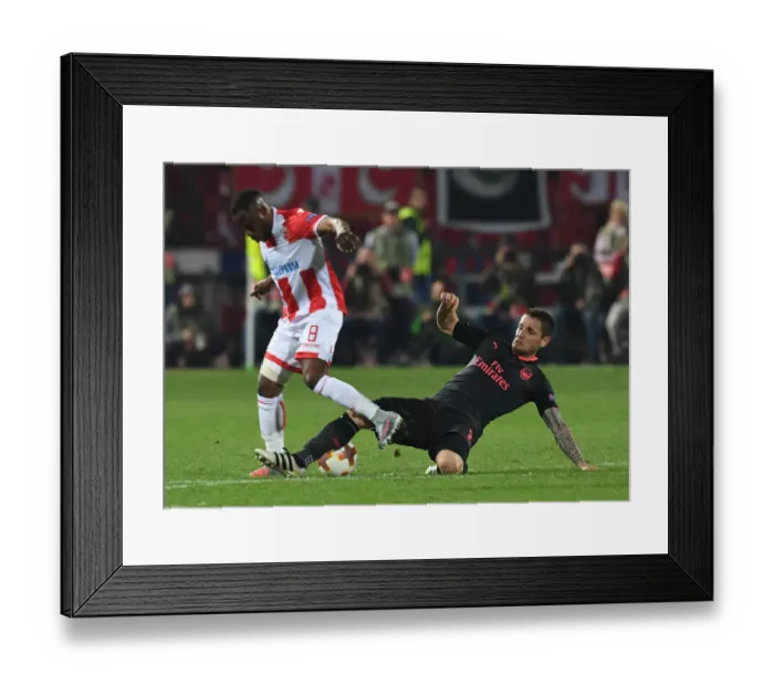 Framed Print : Debuchy vs Kanga: Clash in the Europa League Between Crvena Zvezda and Arsenal Framed Print : Debuchy vs Kanga: Clash in the Europa League Between Crvena Zvezda and Arsenal