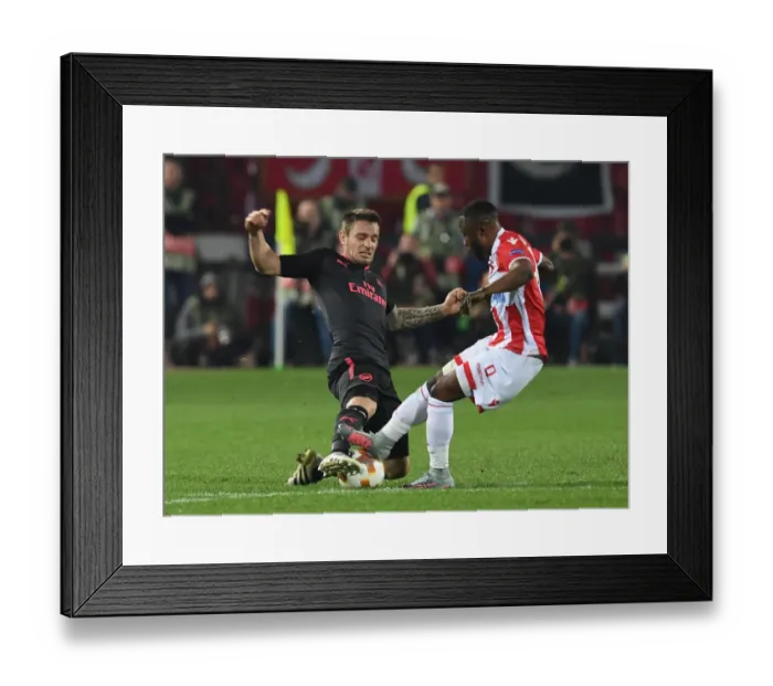 Framed Print : Debuchy vs Kanga: A Europa League Showdown at Rajko Mitic Stadium