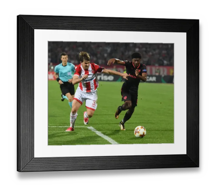 Framed Print : Ainsley Maitland-Niles vs Filip Stojkovic: Battle in the Europa League between Crvena Zvezda and Arsenal Framed Print : Ainsley Maitland-Niles vs Filip Stojkovic: Battle in the Europa League between Crvena Zvezda and Arsenal