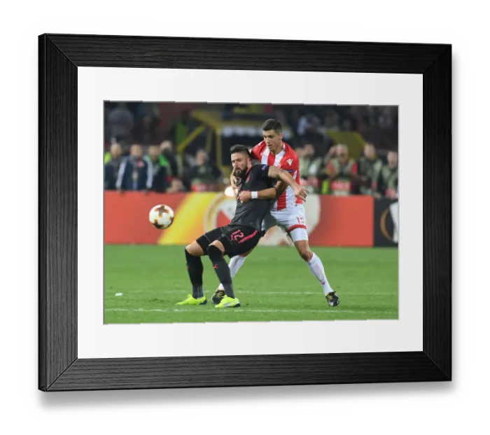 Framed Print : Clash of Titans: Olivier Giroud vs Srdan Babic - Europa League Showdown: Arsenal FC vs Crvena Zvezda (2017-18)