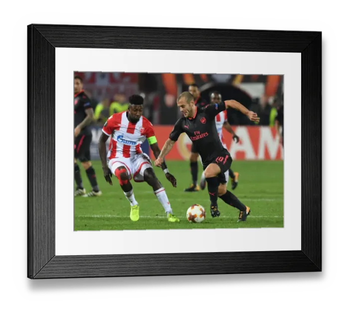 Framed Print : Jack Wilshere's Powerful Past: Overpowering Mitchell Donald in Arsenal's Europa League Triumph