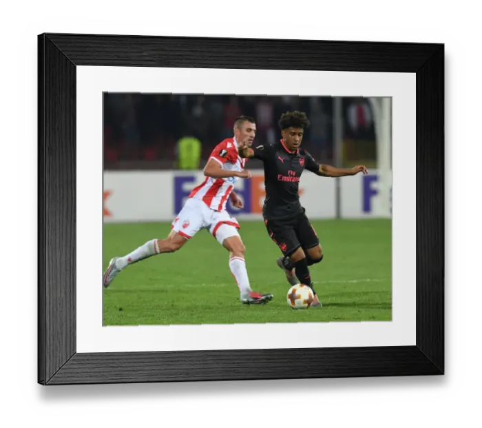 Framed Print : Reiss Nelson's Slick Moves: Outmaneuvering Nenad Krsticic in Arsenal's Europa League Triumph