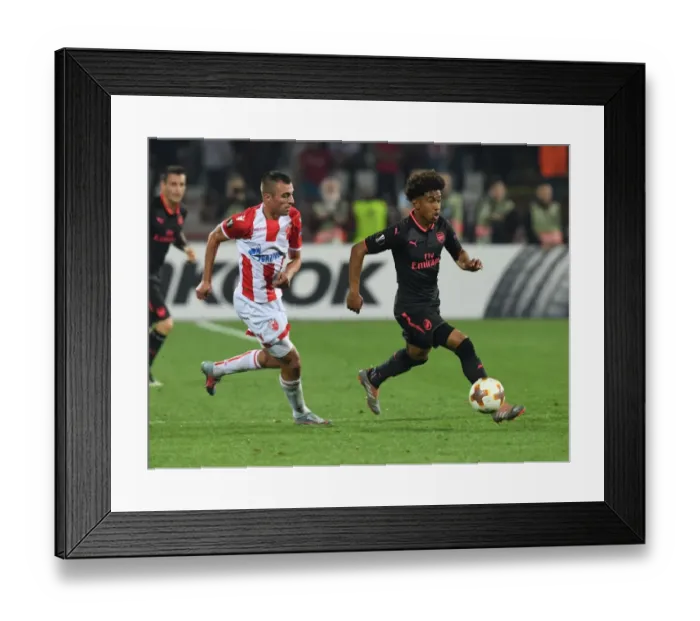 Framed Print : Reiss Nelson Outmaneuvers Nenad Krsticic: Crvena Zvezda vs. Arsenal FC, Europa League 2017-18