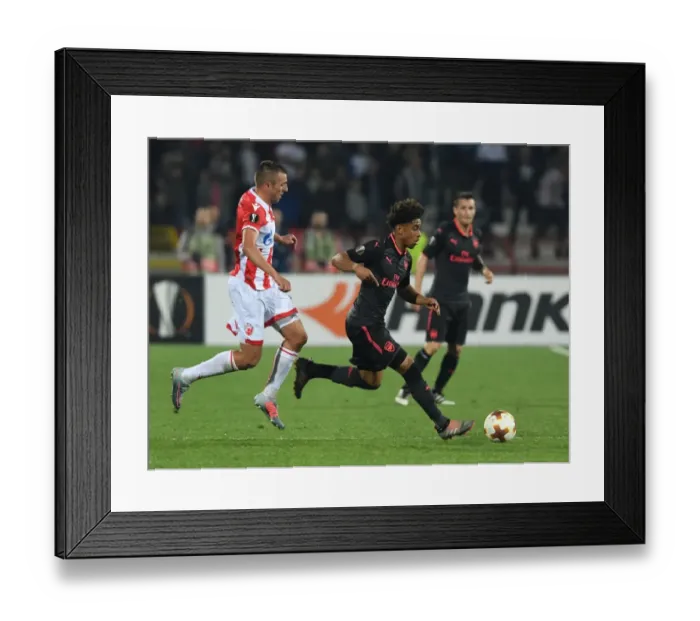 Framed Print : Reiss Nelson Outsmarts Nenad Krsticic: A Europa League Battle at Rajko Mitic Stadium Framed Print : Reiss Nelson Outsmarts Nenad Krsticic: A Europa League Battle at Rajko Mitic Stadium