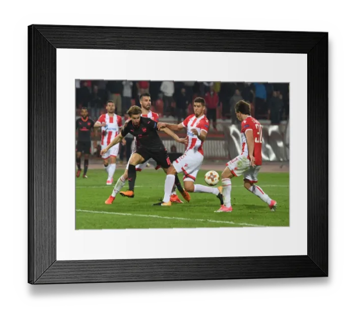 Framed Print : Arsenal's Ben Sheaf Clashes with Filip Stojkovic and Srdan Babic of Red Star Belgrade in Europa League Match Framed Print : Arsenal's Ben Sheaf Clashes with Filip Stojkovic and Srdan Babic of Red Star Belgrade in Europa League Match