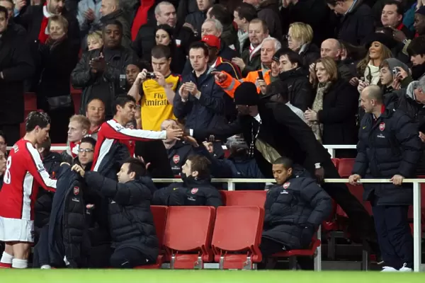 Eduardo (Arsenal) shakes hands with Emmanuel Adebayor