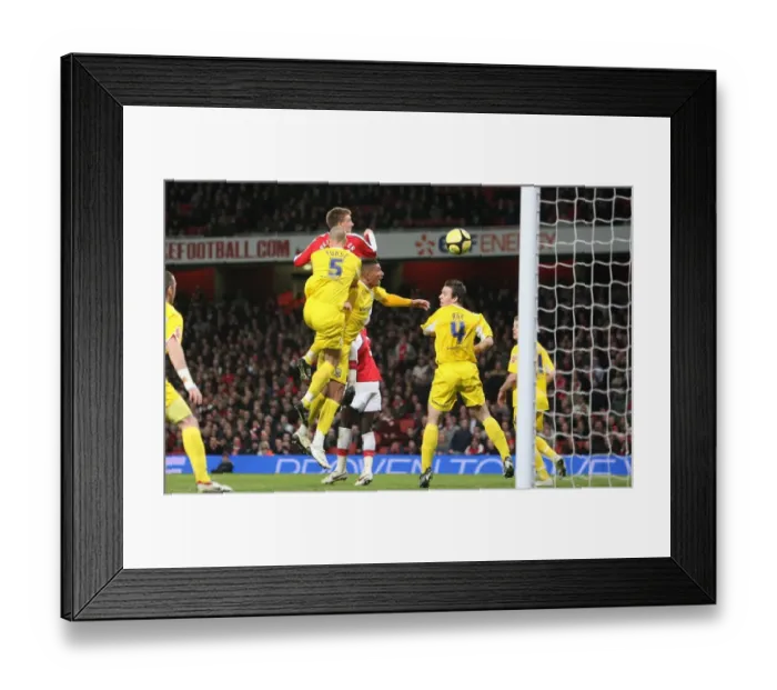 Framed Print : Nicklas Bendtner heads past Cardiff goalkeeper Tom Framed Print : Nicklas Bendtner heads past Cardiff goalkeeper Tom
