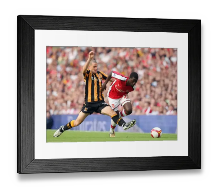Framed Print : Arsenal's Eboue Clashes with Hull's Marney: 1-2 Loss in Premier League Framed Print : Arsenal's Eboue Clashes with Hull's Marney: 1-2 Loss in Premier League