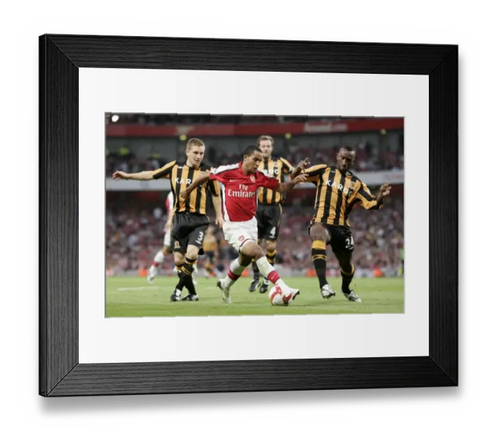 Framed Print : Theo Walcott Faces Defenders Andy Dawson and Kamil Zayatte as Arsenal Suffer 1:2 Defeat to Hull City in Barclays Premier League