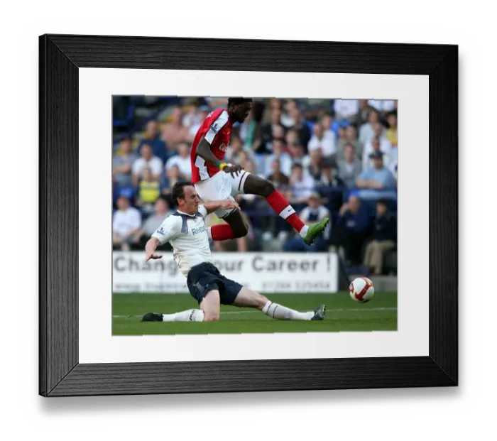 Framed Print : Adebayor Leaps Over O'Brien: Arsenal vs. Bolton Wanderers, Barclays Premier League (2008-2009)