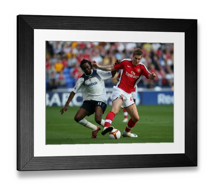 Framed Print : Bolton Wanderers vs. Arsenal: Intense Battle for the Ball - Premier League Soccer (2008-09)