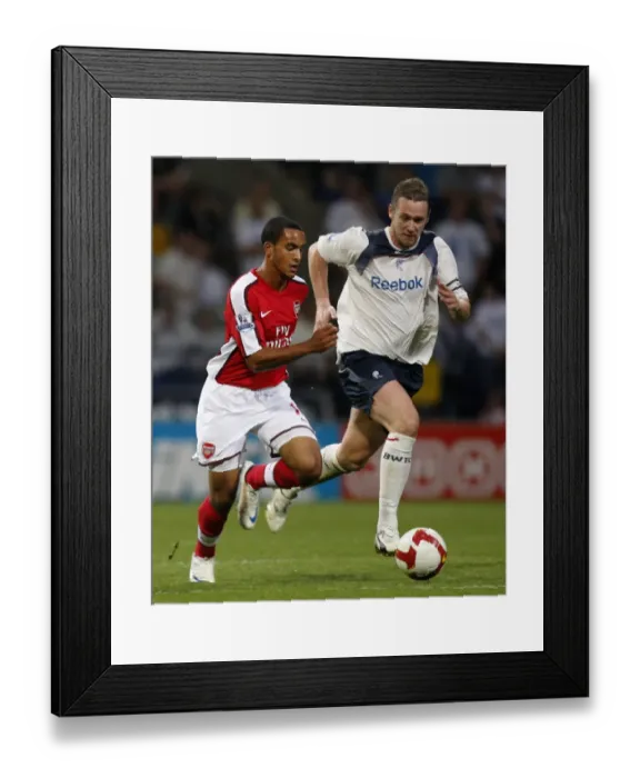 Framed Print : Theo Walcott Outmaneuvers Kevin Nolan: Arsenal's Victory Over Bolton (2008-2009) Framed Print : Theo Walcott Outmaneuvers Kevin Nolan: Arsenal's Victory Over Bolton (2008-2009)