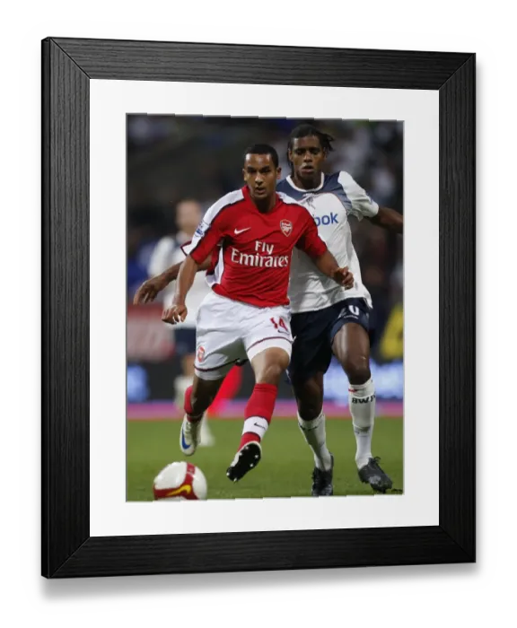 Framed Print : Theo Walcott Outmaneuvers Ricardo Vaz Te: Arsenal's Victory Over Bolton Wanderers in the 2008-2009 Premier League Framed Print : Theo Walcott Outmaneuvers Ricardo Vaz Te: Arsenal's Victory Over Bolton Wanderers in the 2008-2009 Premier League