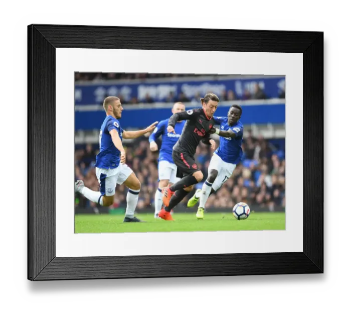 Framed Print : Mesut Ozil's Magical Moment: Outsmarting Vlasic and Gueye at Goodison Park Framed Print : Mesut Ozil's Magical Moment: Outsmarting Vlasic and Gueye at Goodison Park
