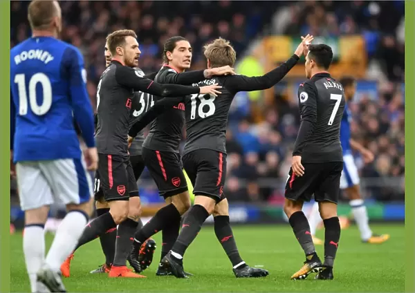 Monreal, Bellerin, and Ramsey Celebrate Arsenal's First Goal Against Everton (2017-18)