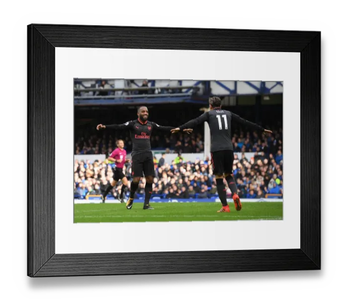Framed Print : Lacazette and Ozil Celebrate Arsenal's Winning Goals Against Everton (2017-18)