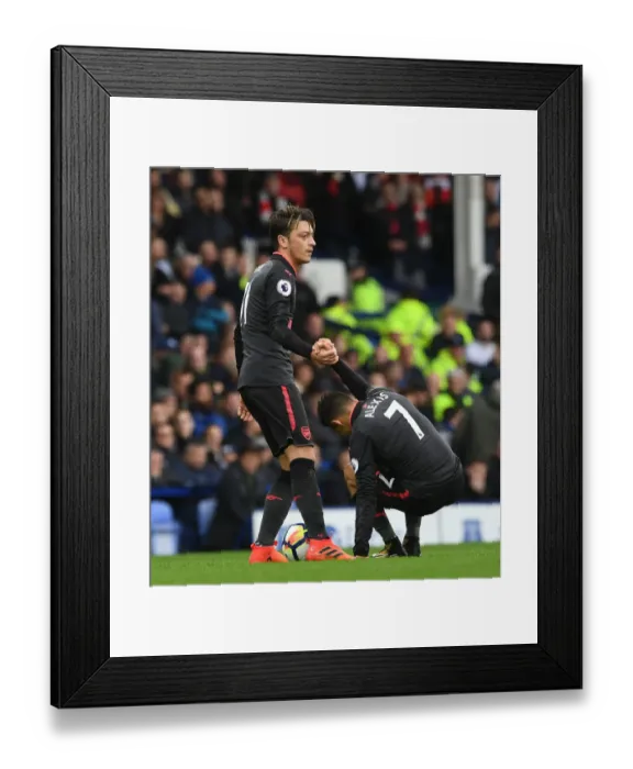 Framed Print : Arsenal Rivals: Sanchez and Ozil in Intense Moment at Everton (2017-18)