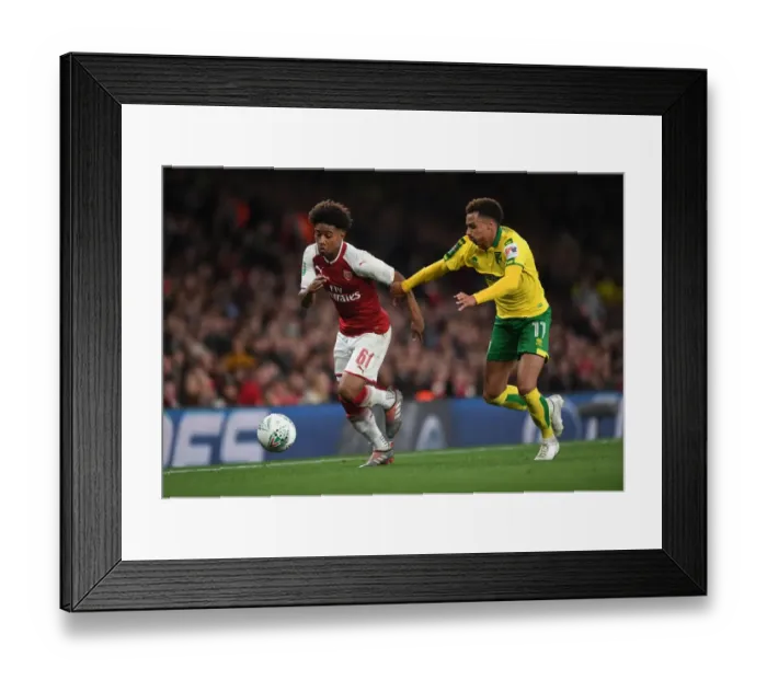 Framed Print : Reiss Nelson vs. Josh Murphy: A Battle in the Carabao Cup Clash Between Arsenal and Norwich