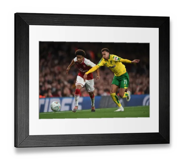 Framed Print : Reiss Nelson vs. Josh Murphy: A Carabao Cup Showdown at Arsenal's Emirates Stadium