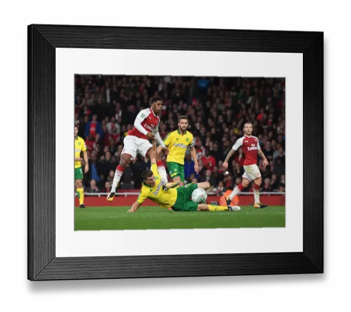 Framed Print : Arsenal's Chuba Akpom Tries to Shoot Past Norwich's Christoph Zimmermann in Carabao Cup Clash