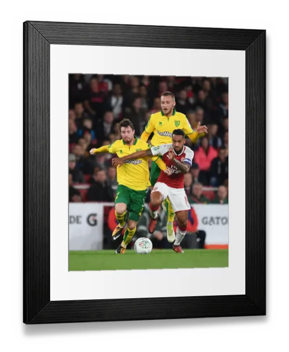 Framed Print : Theo Walcott Clashes with Norwich's James Husband and Tom Trybull during Arsenal's Carabao Cup Fourth Round Match