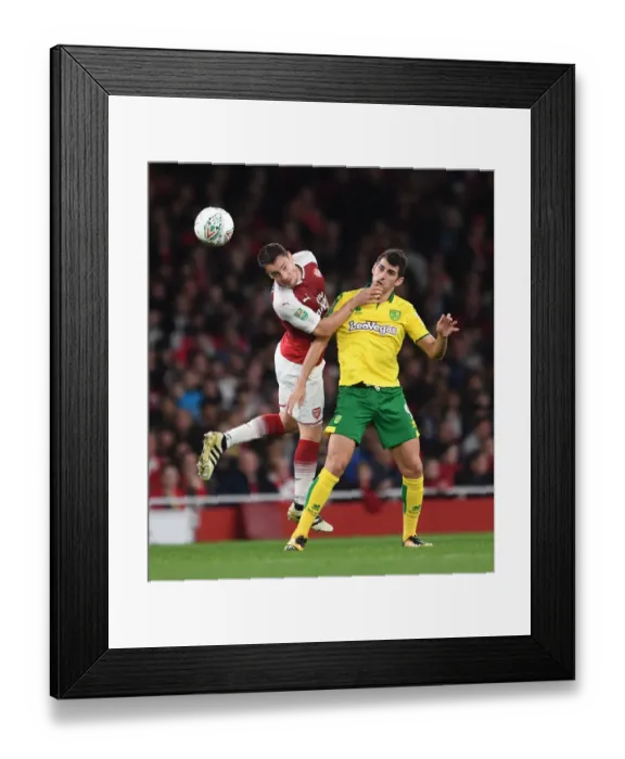 Framed Print : Arsenal vs Norwich: Debuchy Heads Away from Oliveira in Carabao Cup Clash Framed Print : Arsenal vs Norwich: Debuchy Heads Away from Oliveira in Carabao Cup Clash