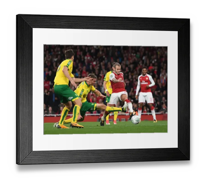 Framed Print : Jack Wilshere vs. Christoph Zimmermann: A Battle in the Carabao Cup Clash Between Arsenal and Norwich Framed Print : Jack Wilshere vs. Christoph Zimmermann: A Battle in the Carabao Cup Clash Between Arsenal and Norwich