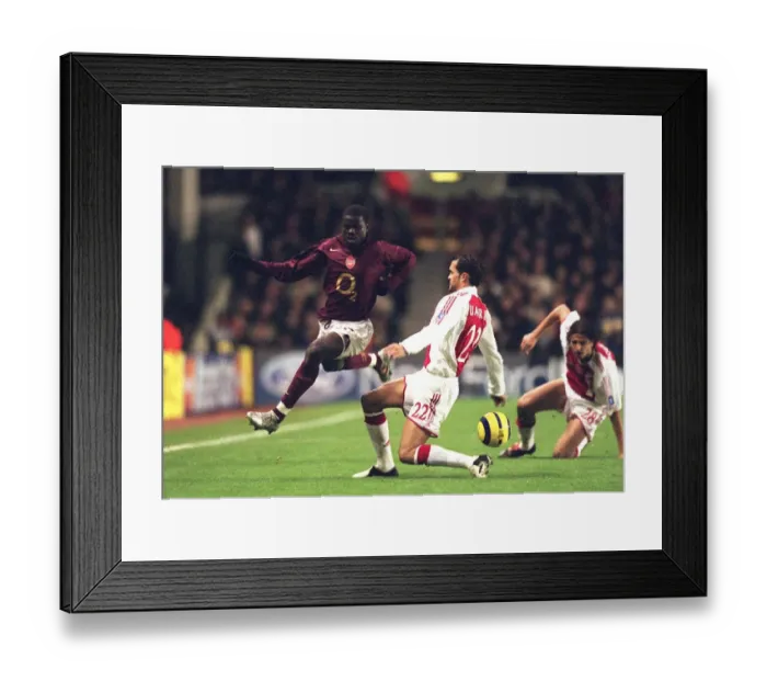Framed Print : Emmanuel Eboue (Arsenal) Juanfran (Ajax). Arsenal 0: 0 Ajax Framed Print : Emmanuel Eboue (Arsenal) Juanfran (Ajax). Arsenal 0: 0 Ajax