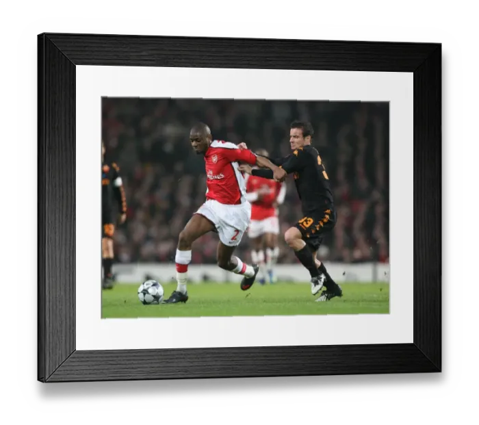 Framed Print : Arsenal's Abou Diaby Clashes with Matteo Brighi of AS Roma in the Champions League First Knockout Round 1st Leg at Emirates Stadium, 2009