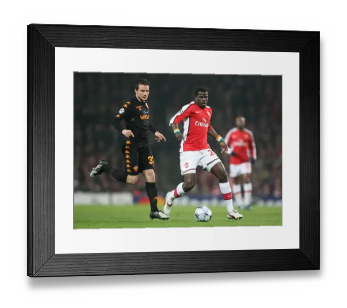 Framed Print : Arsenal's Eboue Clashes with Roma's Brighi in Champs League Showdown at Emirates, 2009