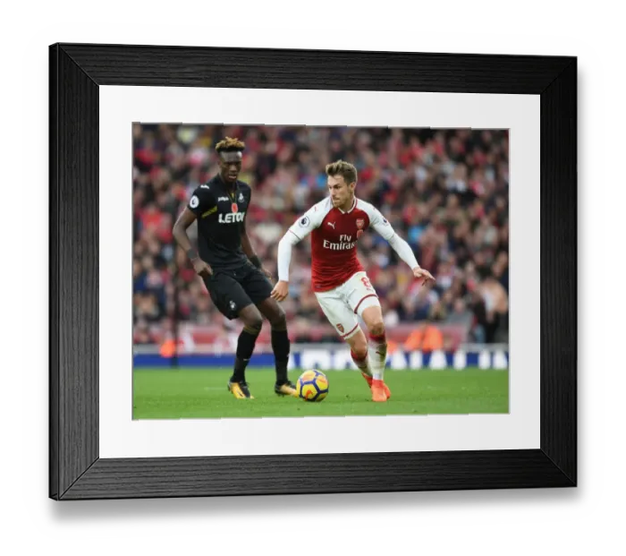 Framed Print : Arsenal's Aaron Ramsey Outmaneuvers Swansea's Tammy Abraham Framed Print : Arsenal's Aaron Ramsey Outmaneuvers Swansea's Tammy Abraham