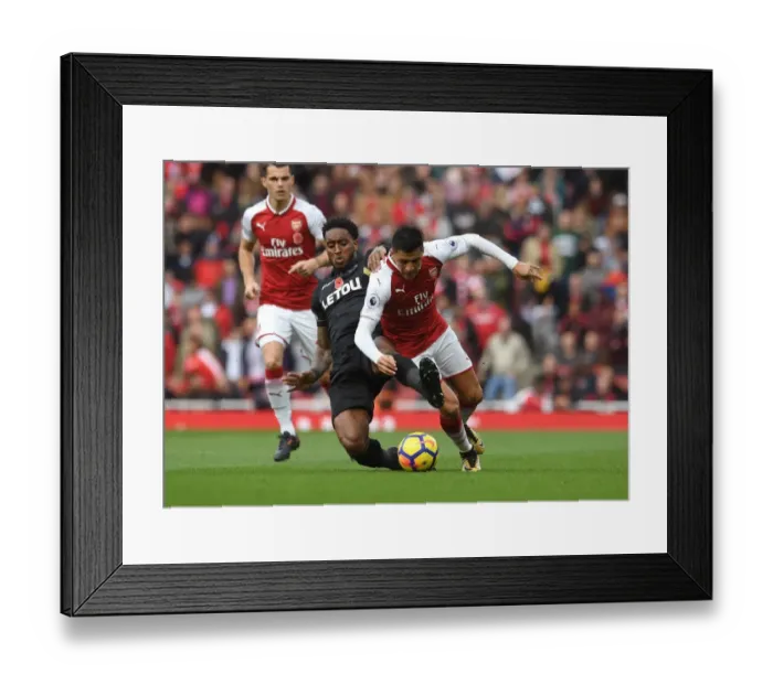 Framed Print : Sanchez vs. Fer: A Football Showdown at Emirates Stadium
