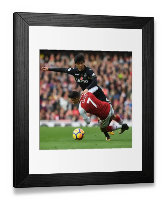 Framed Print : Clash of Stars: Sanchez vs. Ki - Arsenal's Battle against Swansea City Framed Print : Clash of Stars: Sanchez vs. Ki - Arsenal's Battle against Swansea City