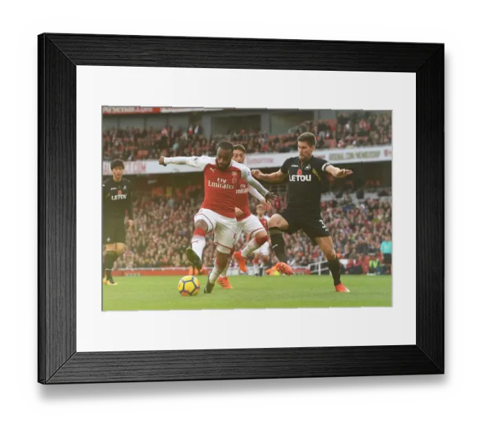 Framed Print : Arsenal's Lacazette Faces Off Against Swansea's Fernandez Framed Print : Arsenal's Lacazette Faces Off Against Swansea's Fernandez