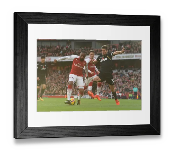 Framed Print : Intense Face-Off: Lacazette vs. Fernandez in Premier League Battle