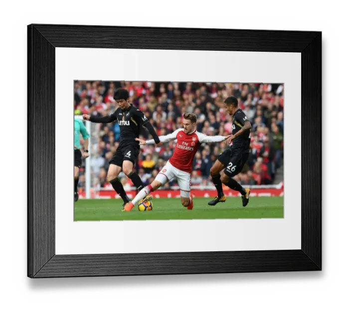 Framed Print : Arsenal's Ramsey Faces Off Against Swansea's Ki and Naughton Framed Print : Arsenal's Ramsey Faces Off Against Swansea's Ki and Naughton